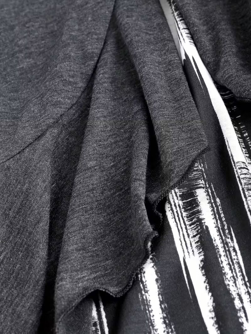 A Long-Sleeved Women'S Top Designed to Look Like Two Pieces