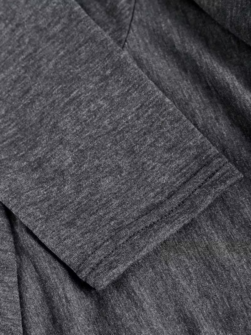 A Long-Sleeved Women'S Top Designed to Look Like Two Pieces